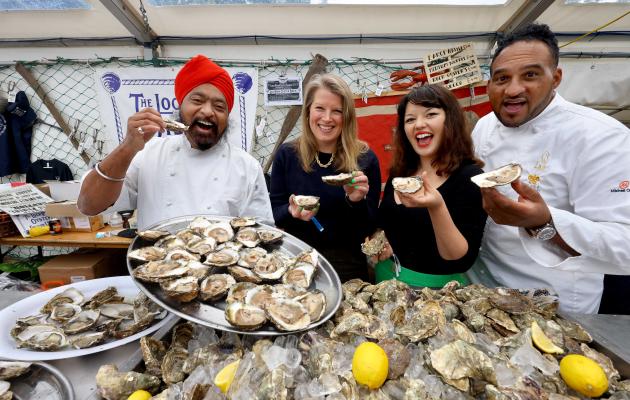 Chefs holding oysters