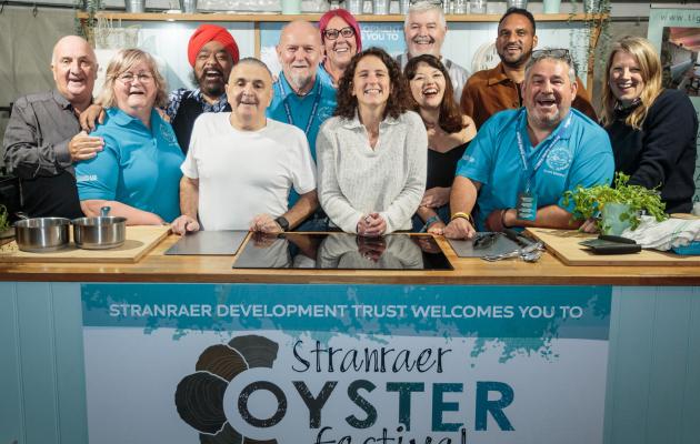 A group of people in the demo kitchen at Stranraer Oyster Festival