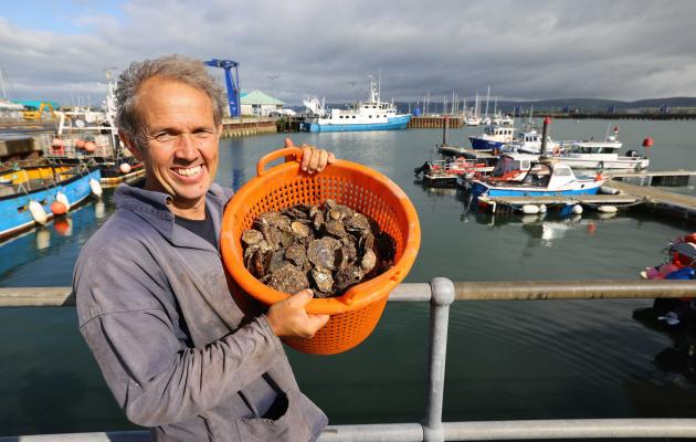 Tristan Hugh-Jones with Loch Ryan native oysters