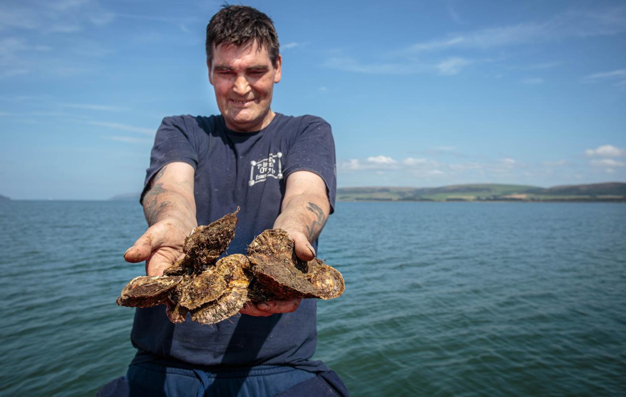 John Mills with native oysters