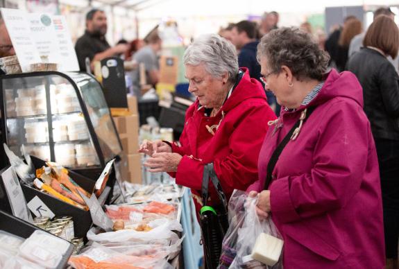 Customers Browsing the Market Marquee