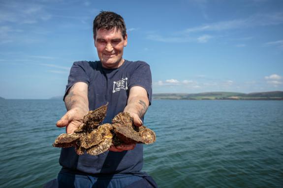 John Mills with native oysters